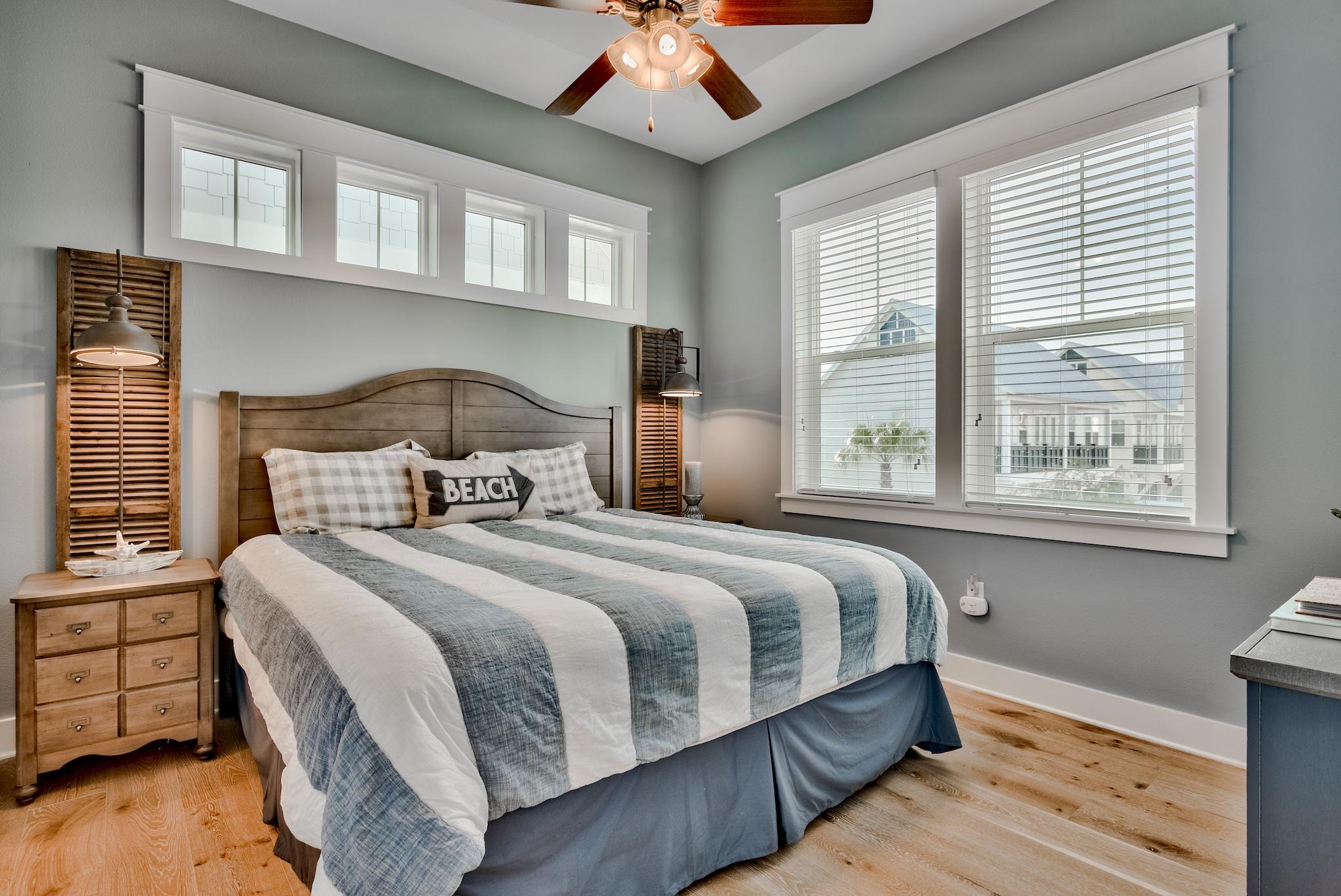 94 Milestone Drive Inlet Beach, Unit C Inlet Beach, FL 32461 - Photo 8 of 41 a bedroom with bed and a large window