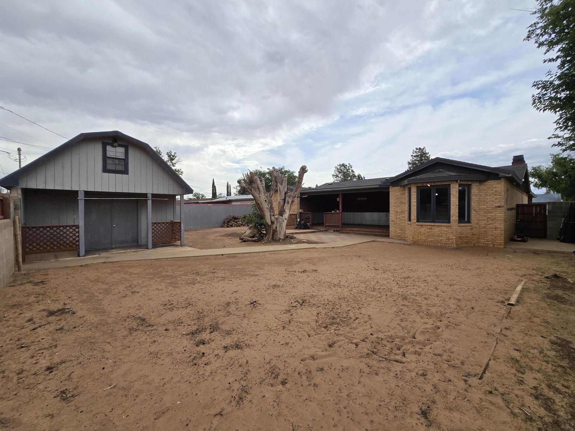 506 North 19th Street Lamesa, TX 79331 - Photo 24 of 29 a view of a house with a yard and garage
