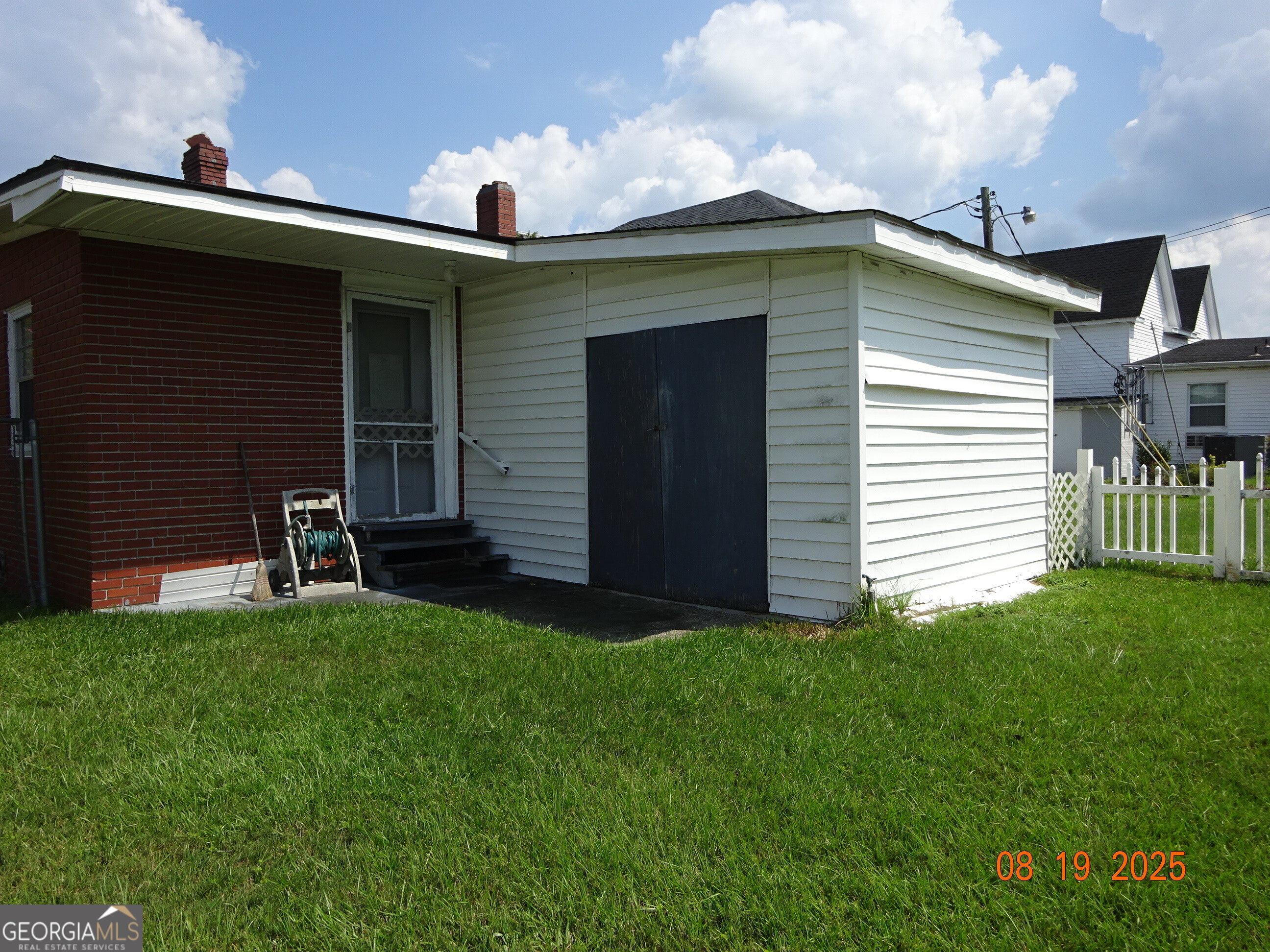 6 North Spring Street Claxton, GA 30417 - Photo 24 of 26 a front view of a house with a yard