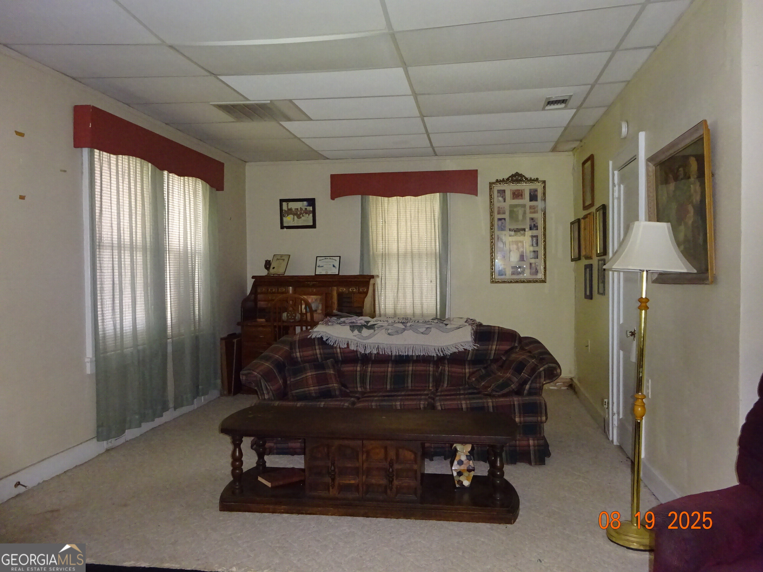6 North Spring Street Claxton, GA 30417 - Photo 4 of 26 a bed sitting in a spacious bedroom next to a window