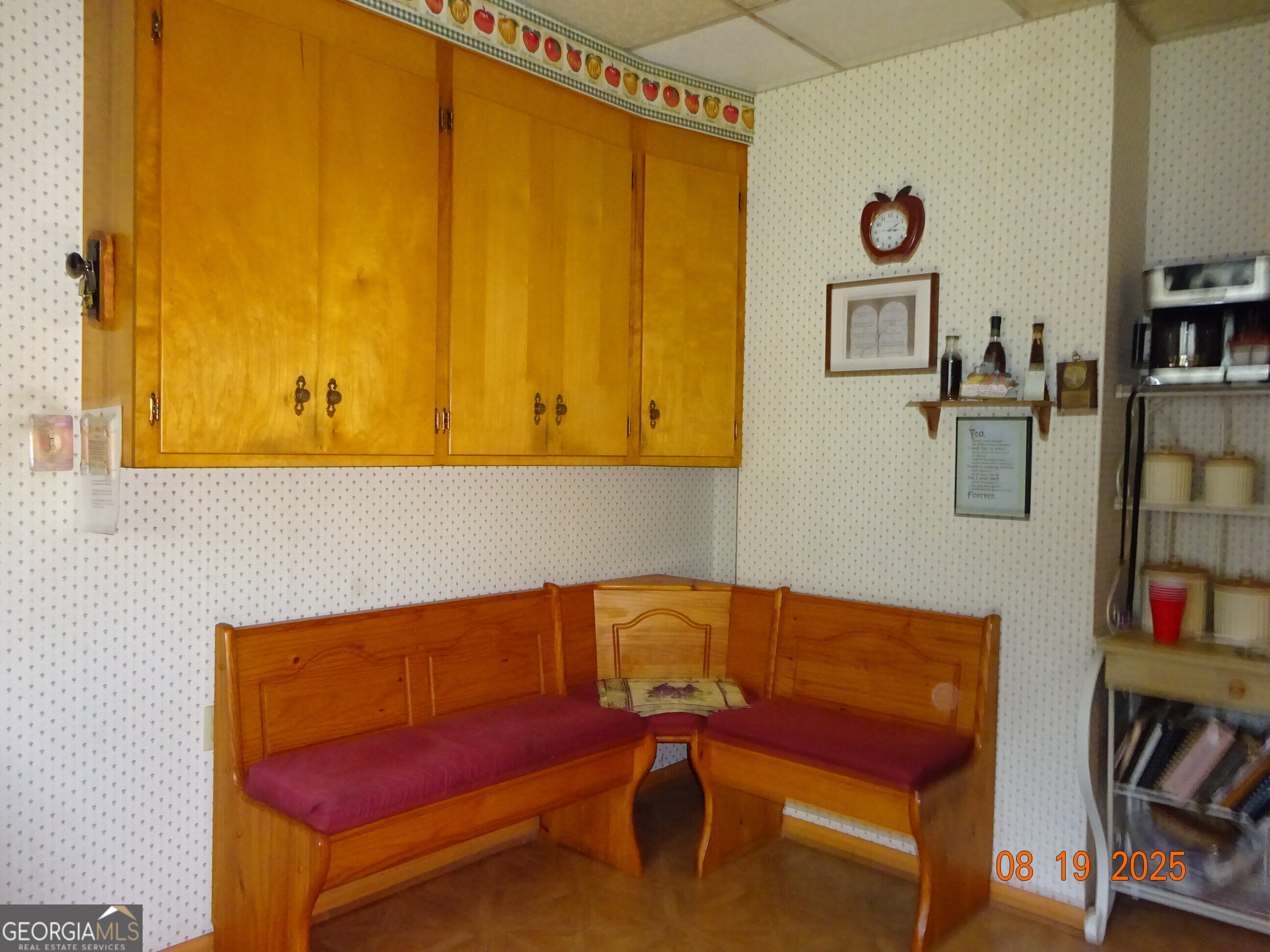 6 North Spring Street Claxton, GA 30417 - Photo 7 of 26 a hallway with a couch and book shelf