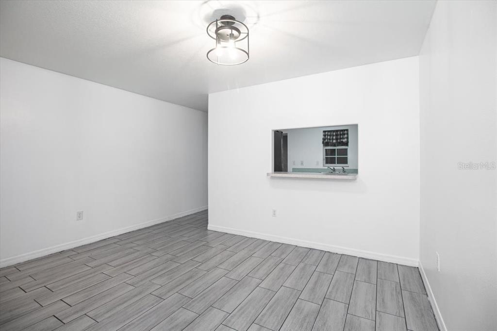 12946 Trade Port Place Riverview, FL 33579 - Photo 16 of 26 a view of a room with wooden floor