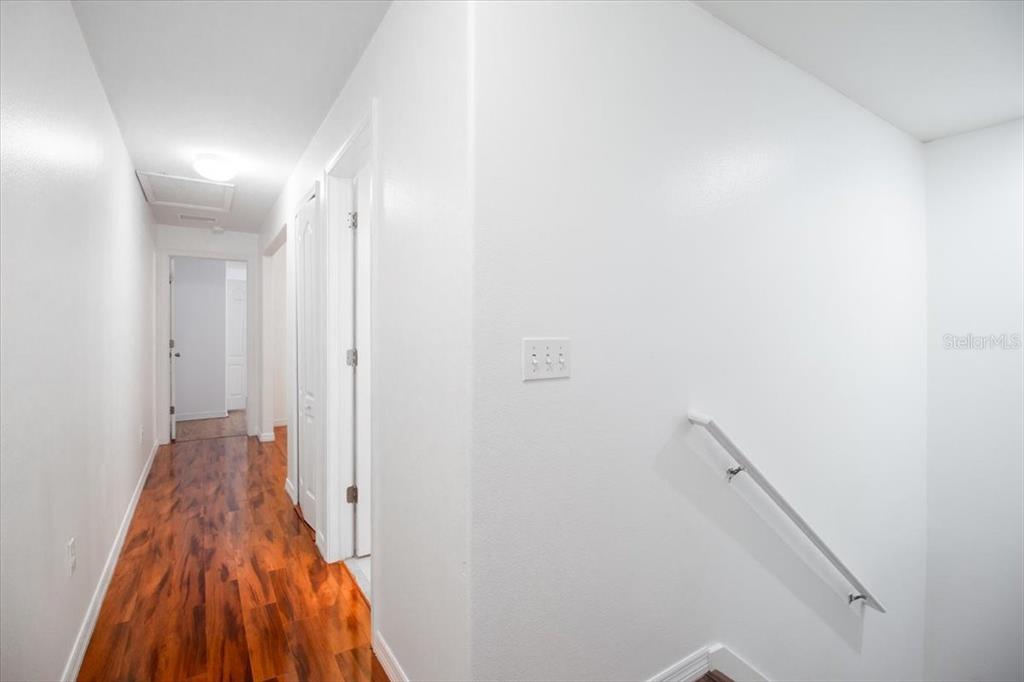 12946 Trade Port Place Riverview, FL 33579 - Photo 21 of 26 a view of a hallway with wooden floor