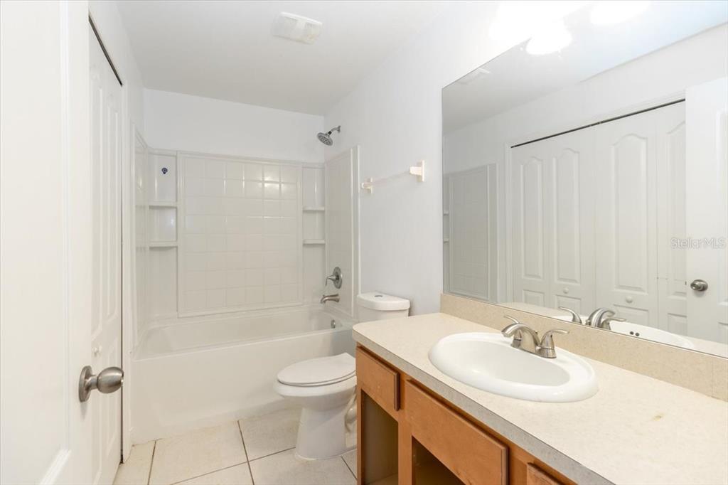 12946 Trade Port Place Riverview, FL 33579 - Photo 22 of 26 a bathroom with a sink toilet tub and shower