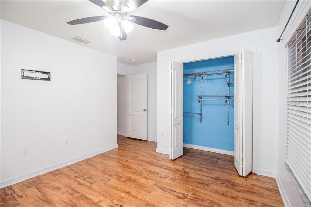 12946 Trade Port Place Riverview, FL 33579 - Photo 25 of 26 a view of an empty room with wooden floor