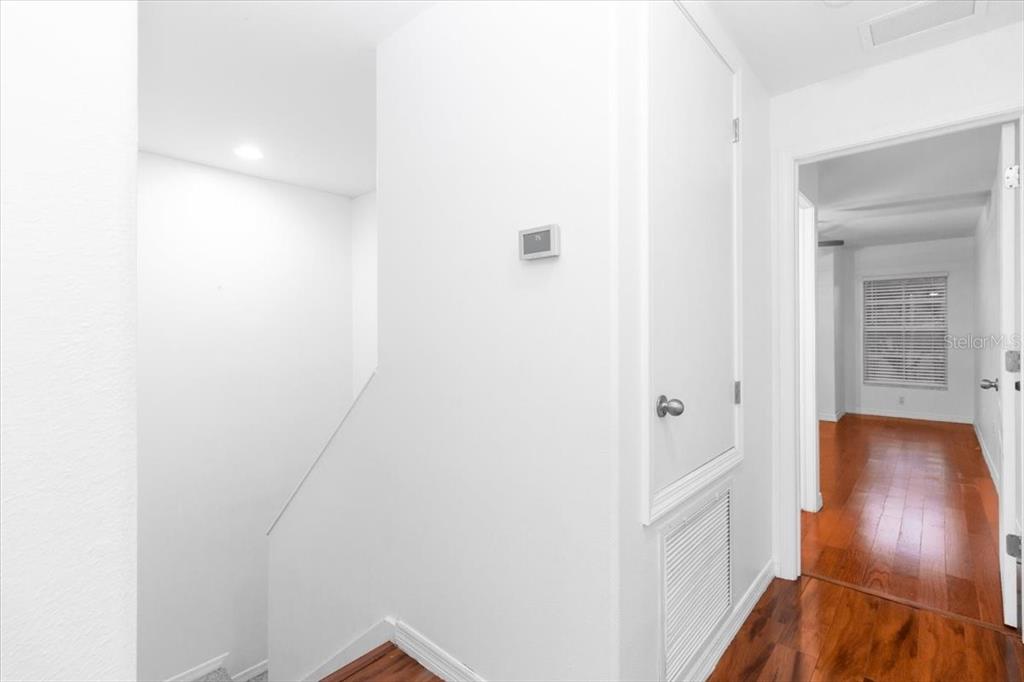 12946 Trade Port Place Riverview, FL 33579 - Photo 26 of 26 a view of a hallway with wooden floor
