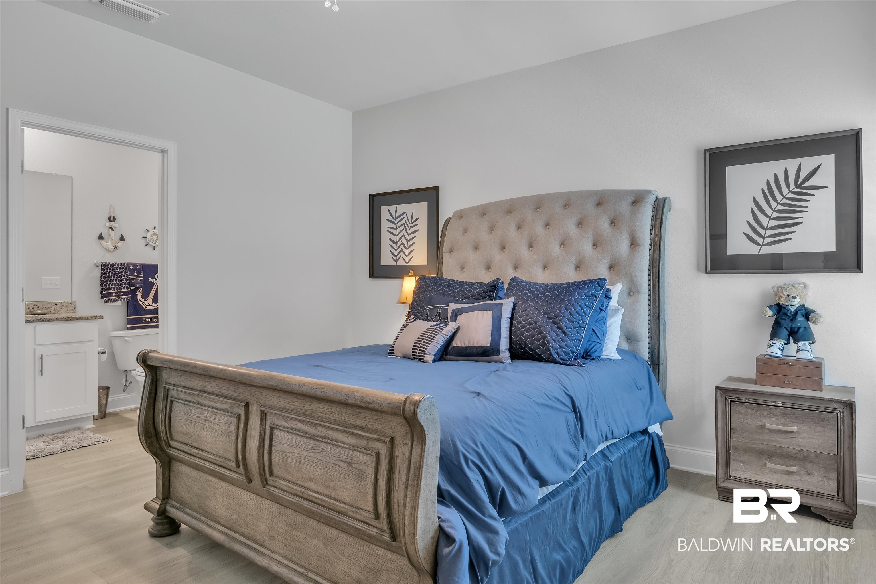 27862 Jade Court Daphne, AL 36526 - Photo 25 of 33 Bedroom featuring light wood-style flooring, visible vents, and baseboards