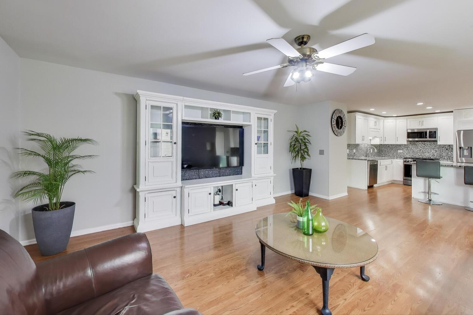 635 Huron Drive Romeoville, IL 60446 - Photo 13 of 32 a living room with furniture and a flat screen tv