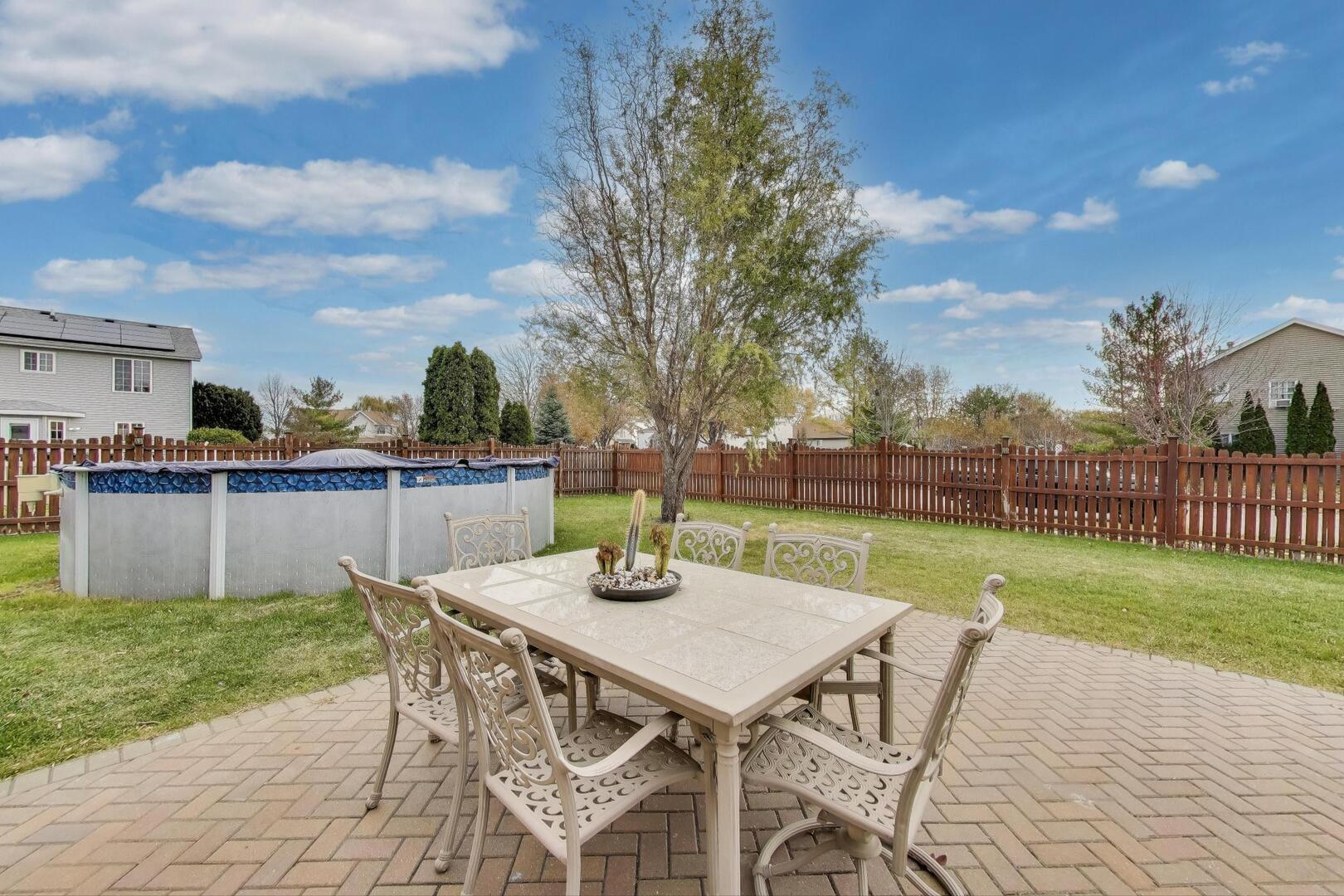 635 Huron Drive Romeoville, IL 60446 - Photo 24 of 32 a view of a patio with table and chairs and garden