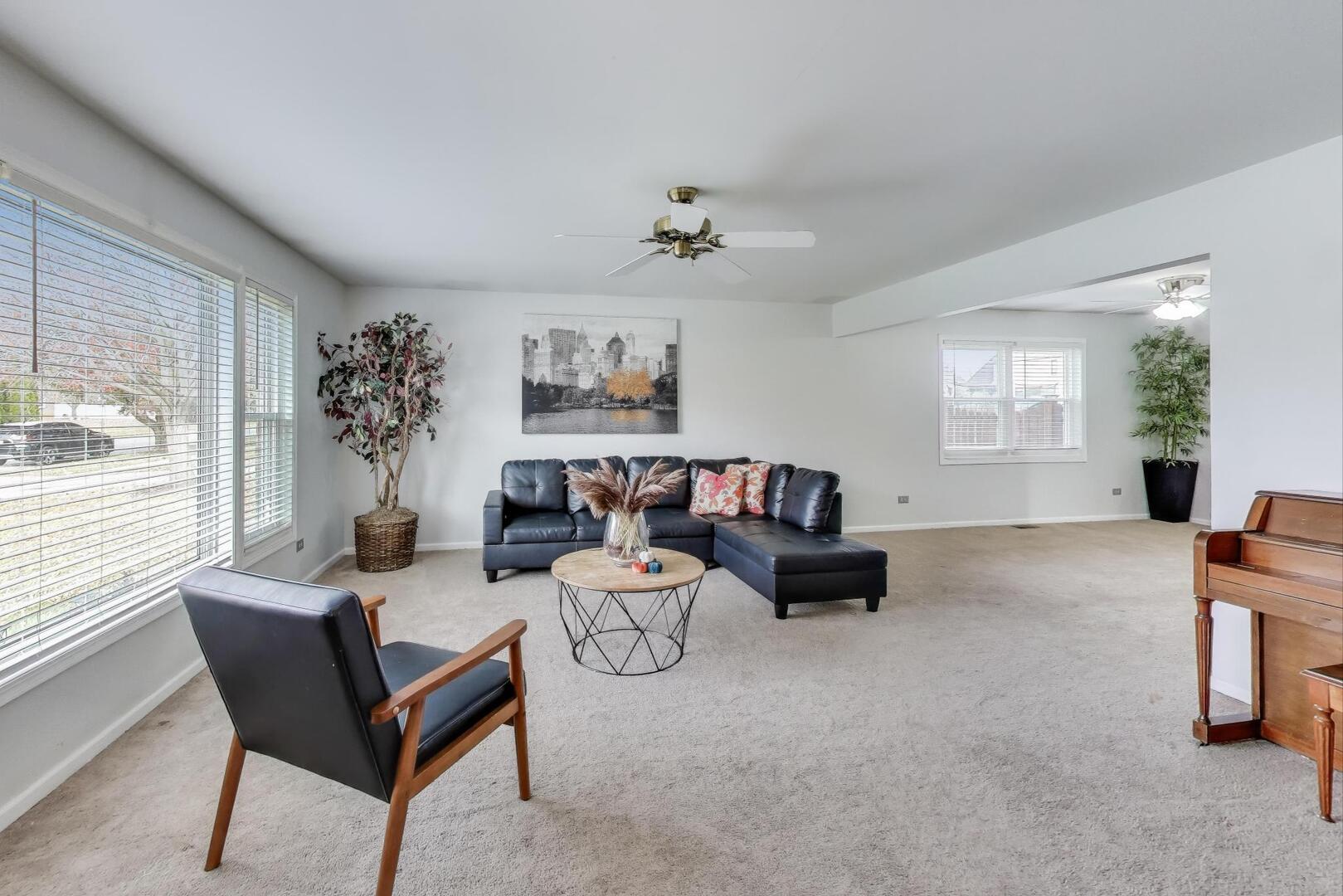 635 Huron Drive Romeoville, IL 60446 - Photo 3 of 32 a living room with furniture and a window