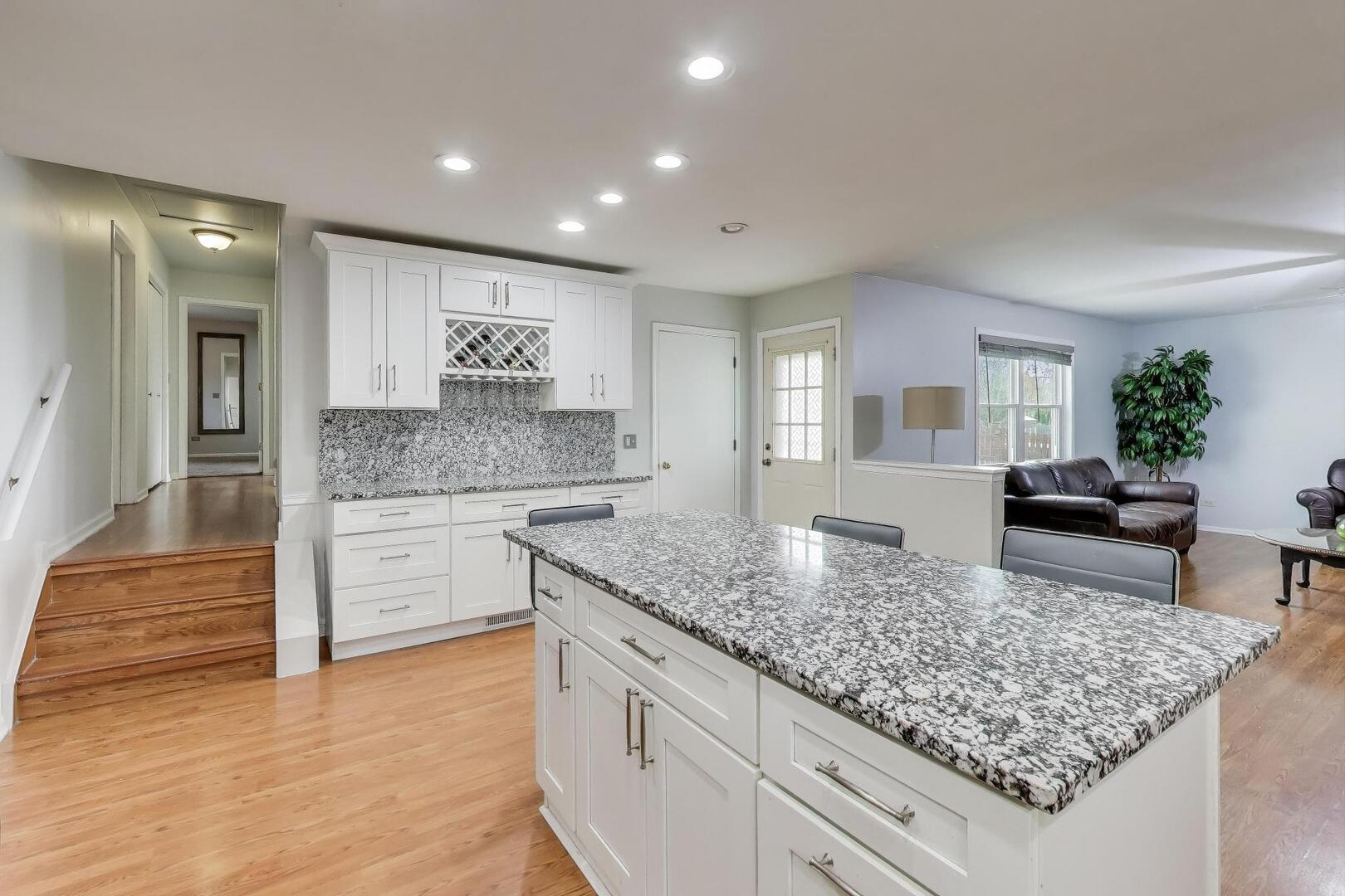 635 Huron Drive Romeoville, IL 60446 - Photo 10 of 32 a kitchen with counter top space cabinets and center island
