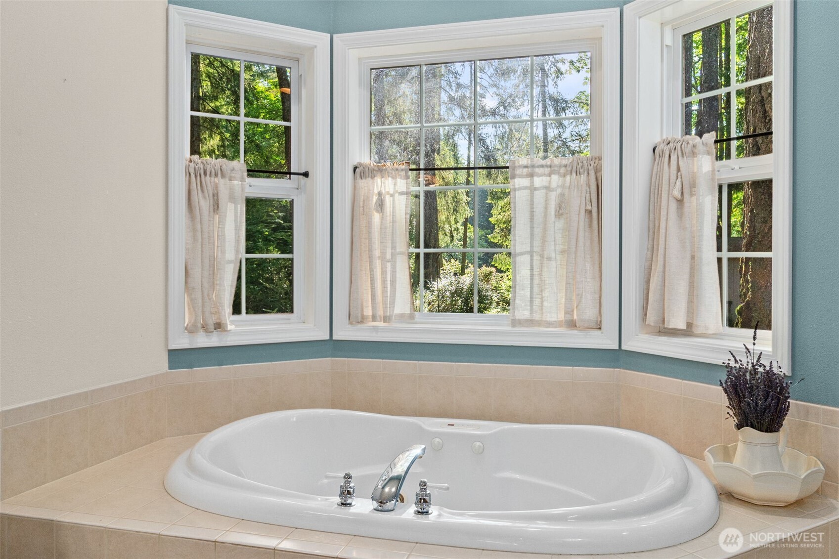 1130 East Sunset Hill Road Shelton, WA 98584 - Photo 27 of 40 a white bath tub sitting next to a window