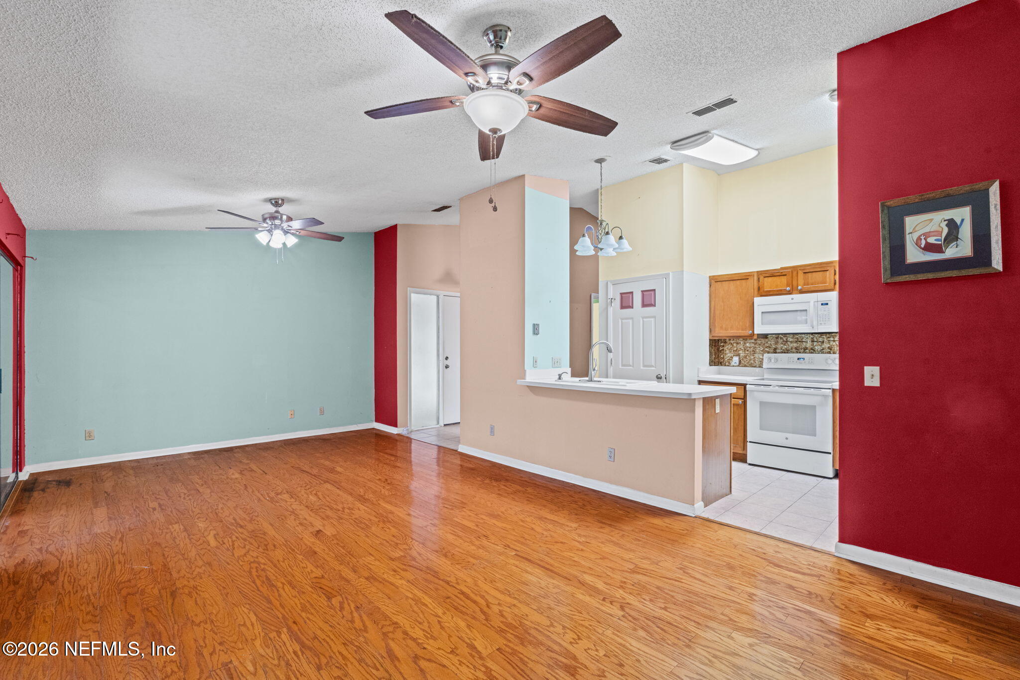36 Navarra Court St. Augustine, FL 32086 - Photo 13 of 42 wooden floor in an empty room with a window