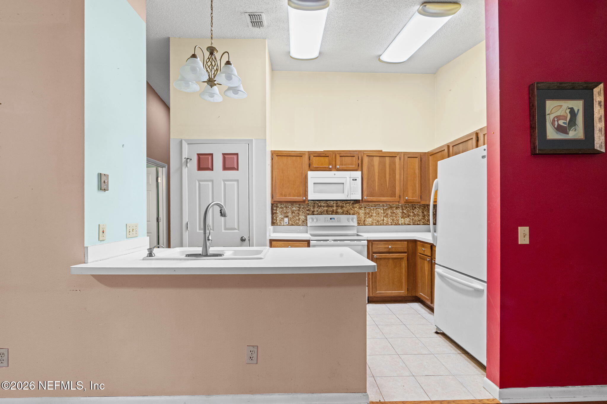 36 Navarra Court St. Augustine, FL 32086 - Photo 14 of 42 a kitchen with stainless steel appliances granite countertop a refrigerator a stove and a sink
