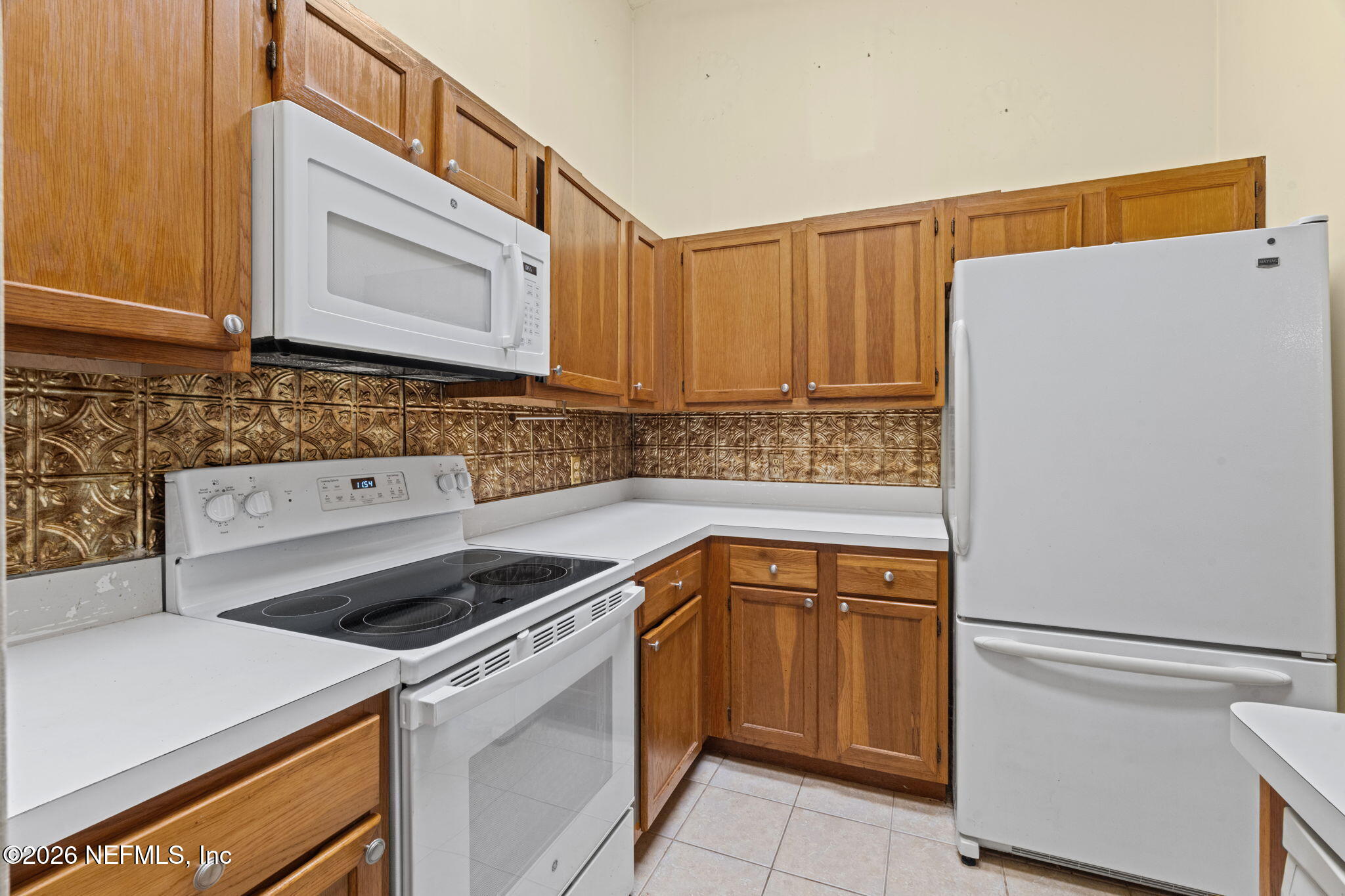 36 Navarra Court St. Augustine, FL 32086 - Photo 16 of 42 a kitchen with a sink a stove and a refrigerator