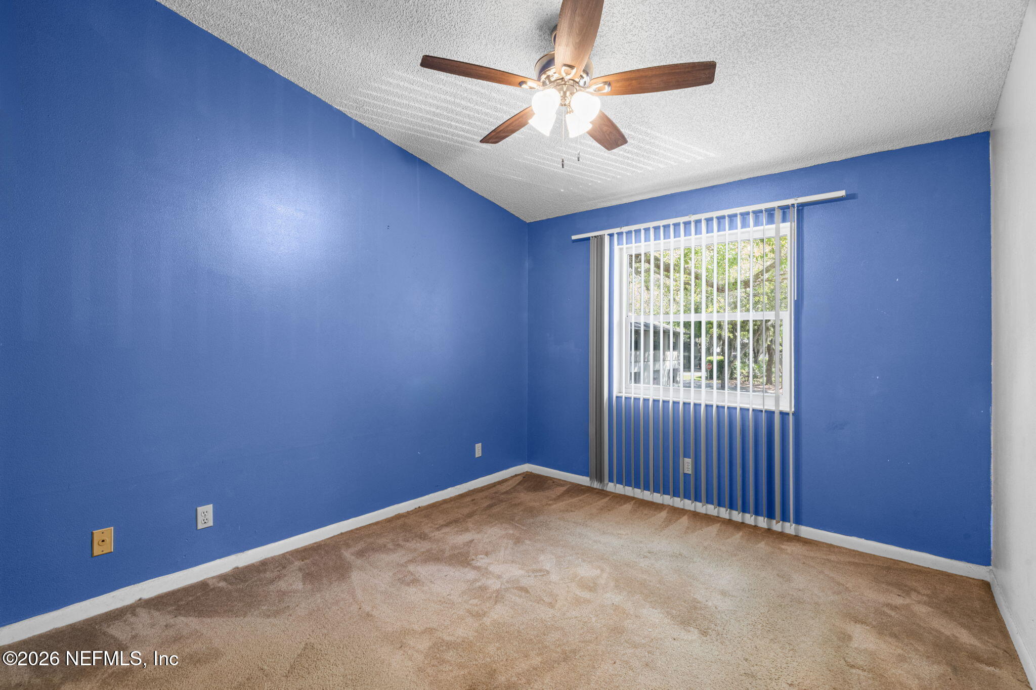 36 Navarra Court St. Augustine, FL 32086 - Photo 22 of 42 an empty room with windows and fan