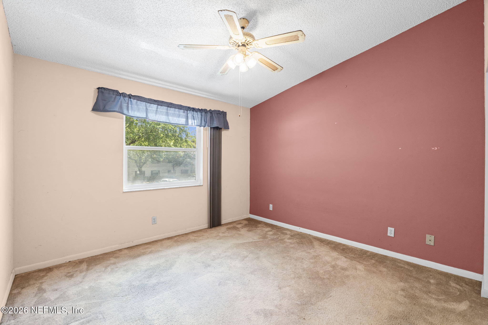 36 Navarra Court St. Augustine, FL 32086 - Photo 26 of 42 an empty room with a window and a fan