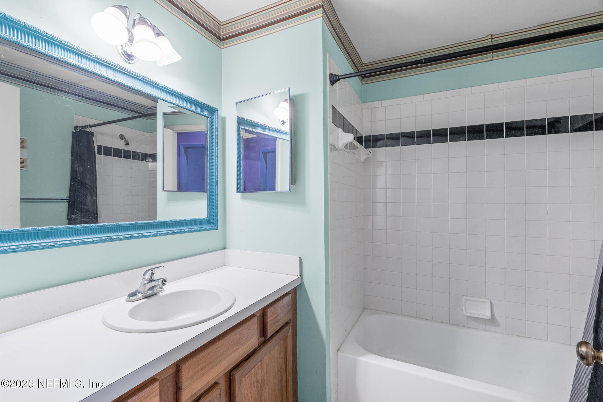 36 Navarra Court St. Augustine, FL 32086 - Photo 28 of 42 a bathroom with a sink and a mirror