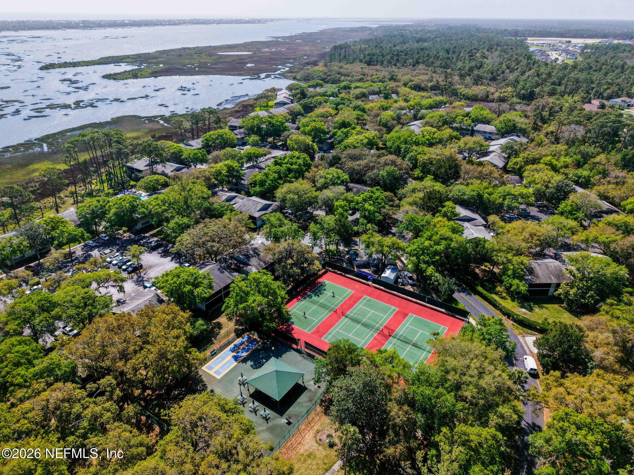 36 Navarra Court St. Augustine, FL 32086 - Photo 32 of 42 an aerial view of a houses with a lush green hillside