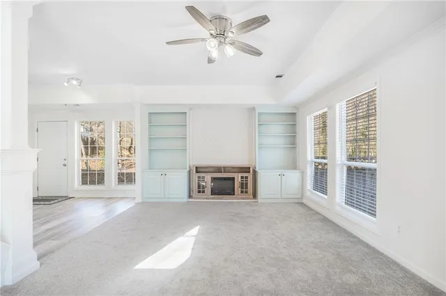 a view of kitchen with wooden floor and electronic appliances