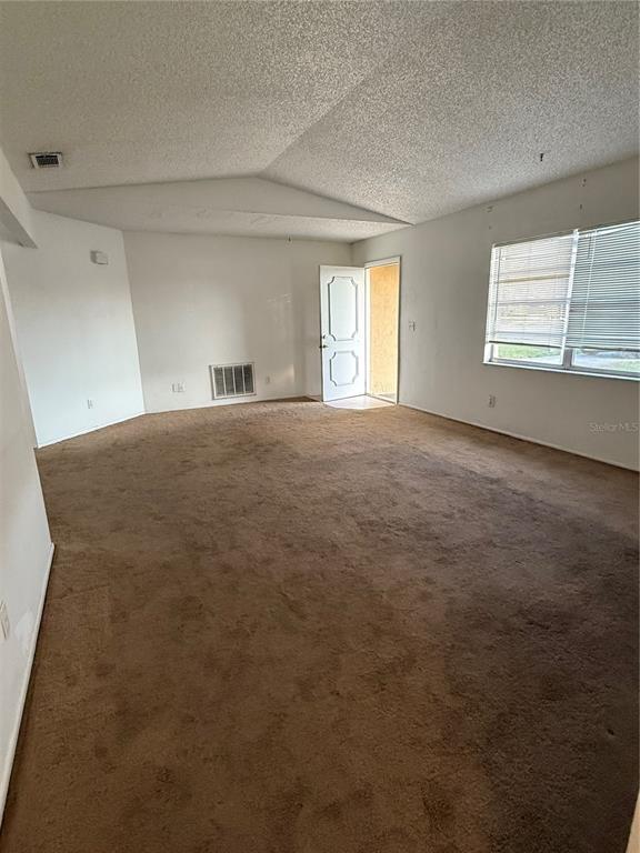 9007 Spring Hill Drive Spring Hill, FL 34608 - Photo 3 of 12 a view of an empty room with a window