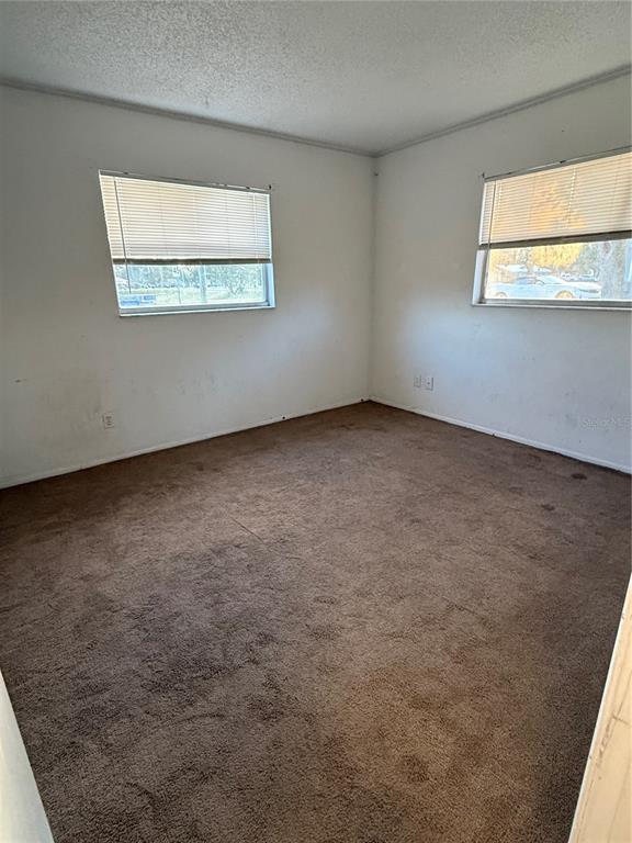 9007 Spring Hill Drive Spring Hill, FL 34608 - Photo 10 of 12 an empty room with a window