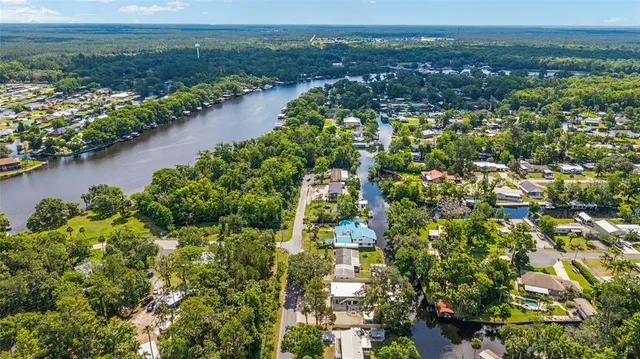 a view of a roof deck with chair and wooden floor