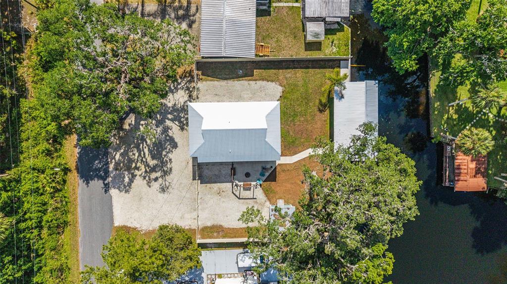 24628 Fox Road Astor, FL 32102 - Photo 16 of 96 an aerial view of a house with a yard swimming pool and outdoor seating
