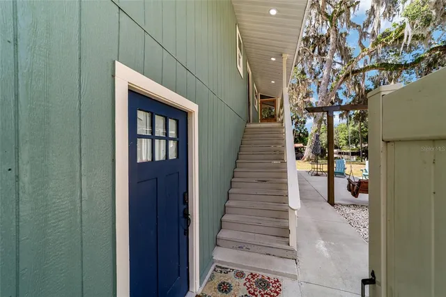 a kitchen with stainless steel appliances a sink and a refrigerator