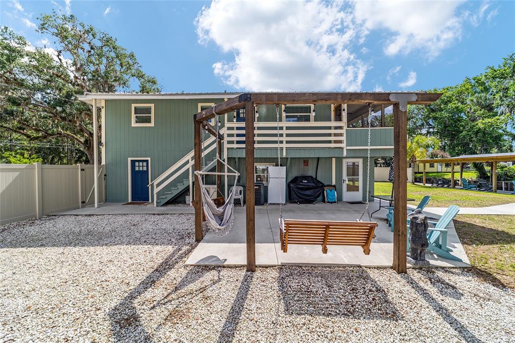 24628 Fox Road Astor, FL 32102 - Photo 31 of 96 a view of a house with backyard and sitting area