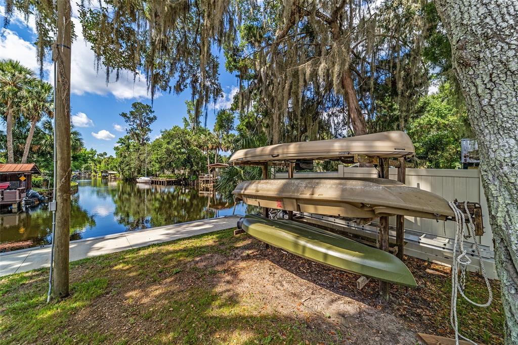 24628 Fox Road Astor, FL 32102 - Photo 37 of 96 a view of a wooden deck with a yard