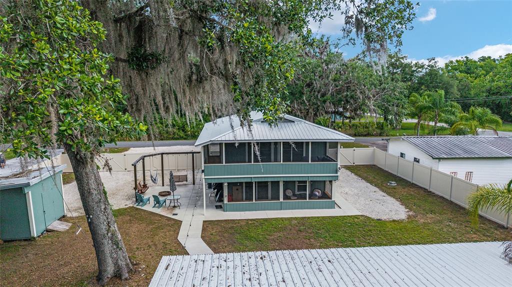 24628 Fox Road Astor, FL 32102 - Photo 5 of 96 a view of a house with backyard and sitting area