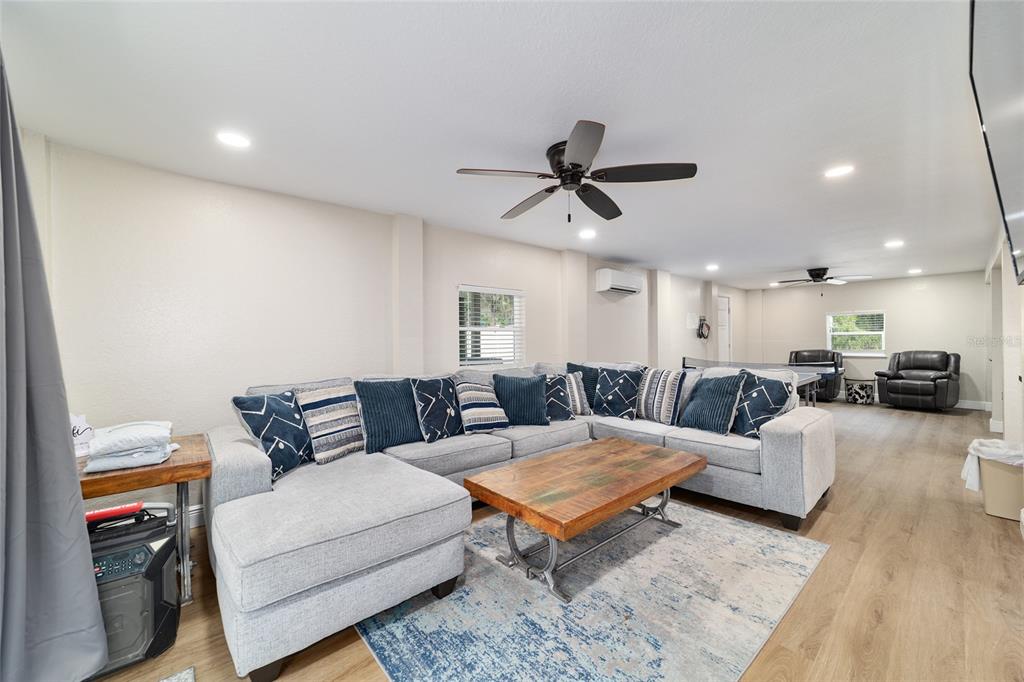 24628 Fox Road Astor, FL 32102 - Photo 58 of 96 a living room with furniture and a wooden floor