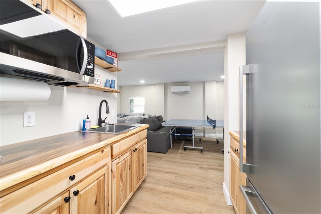 24628 Fox Road Astor, FL 32102 - Photo 61 of 96 a kitchen with a sink and cabinets