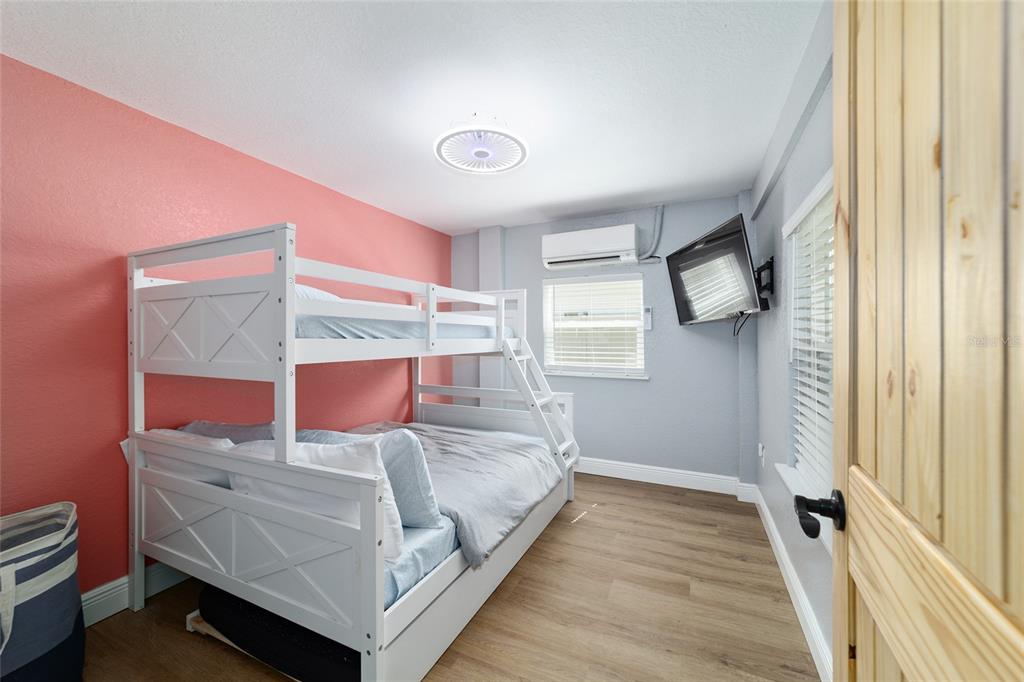 24628 Fox Road Astor, FL 32102 - Photo 64 of 96 a bedroom with a bed and window