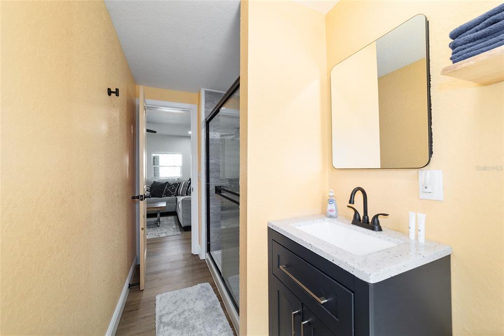 24628 Fox Road Astor, FL 32102 - Photo 68 of 96 a en suite bathroom with a sink and a mirror