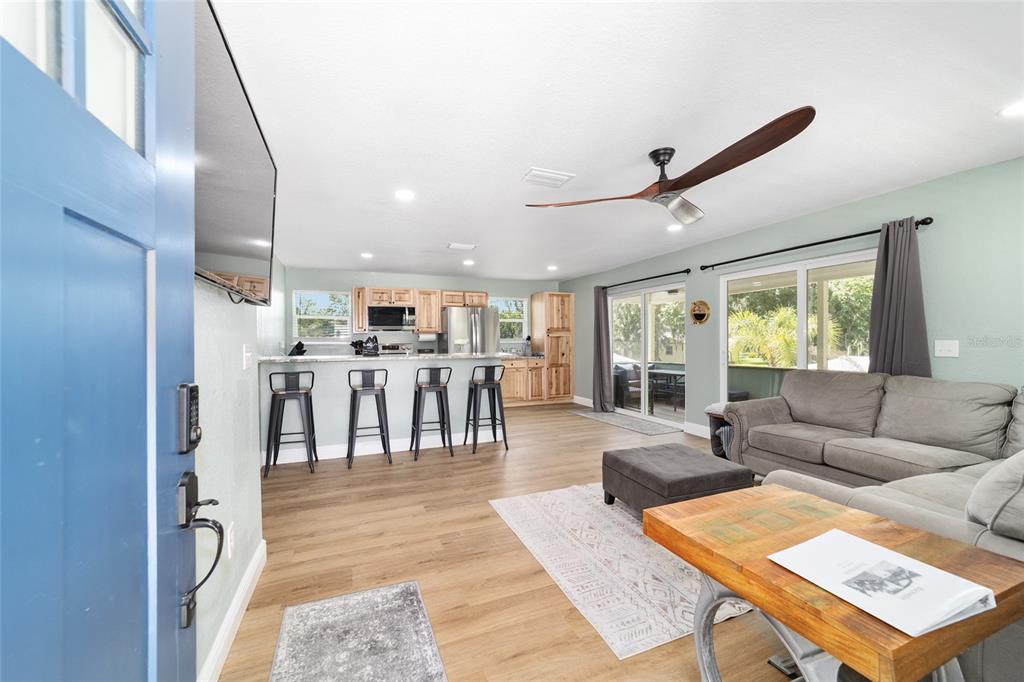 24628 Fox Road Astor, FL 32102 - Photo 74 of 96 a living room with lots of furniture and a table