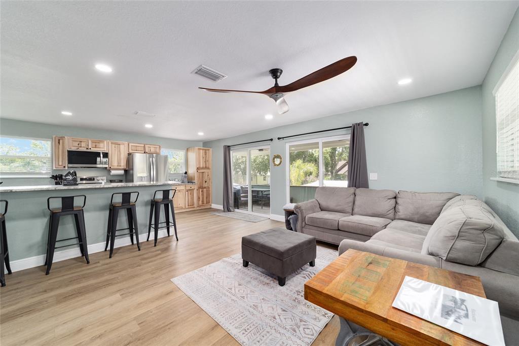 24628 Fox Road Astor, FL 32102 - Photo 75 of 96 a living room with furniture and kitchen view