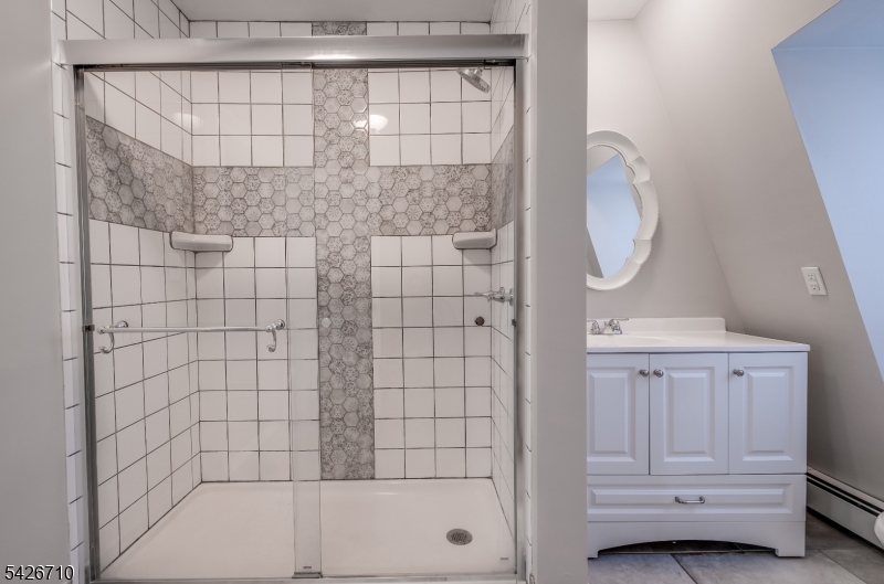 47 Ridgedale Avenue Morristown, NJ 07960 - Photo 11 of 14 a bathroom with a bathtub and a shower