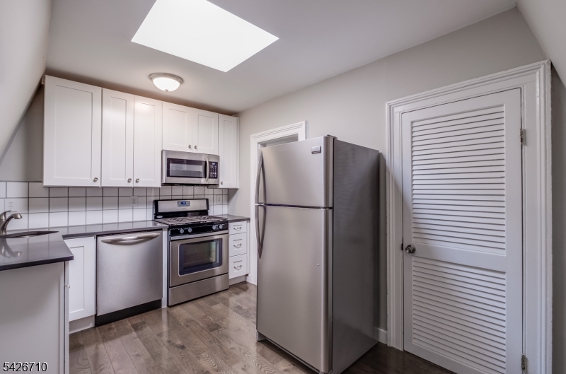 47 Ridgedale Avenue Morristown, NJ 07960 - Photo 14 of 14 a kitchen with a refrigerator stove and sink