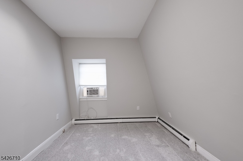 47 Ridgedale Avenue Morristown, NJ 07960 - Photo 7 of 14 a view of an empty room with a window
