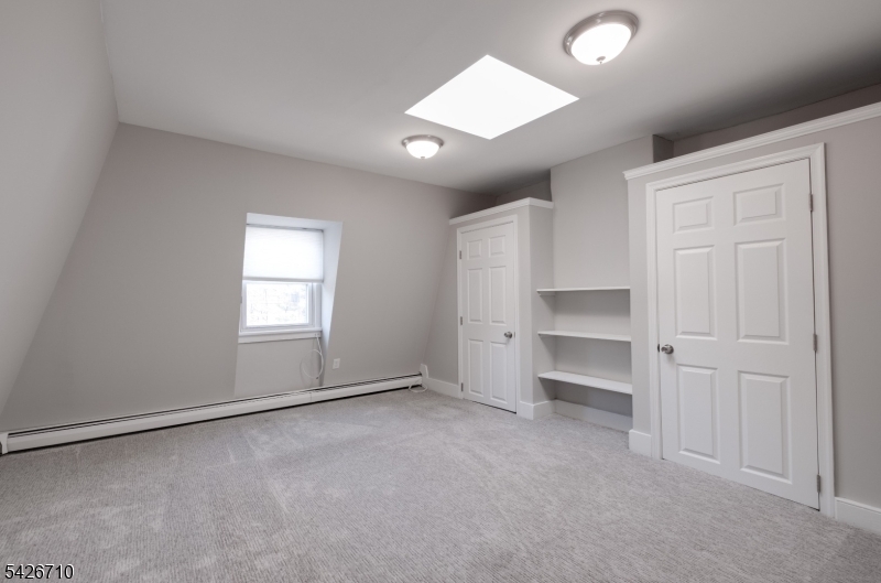 47 Ridgedale Avenue Morristown, NJ 07960 - Photo 8 of 14 an empty room with windows and closet