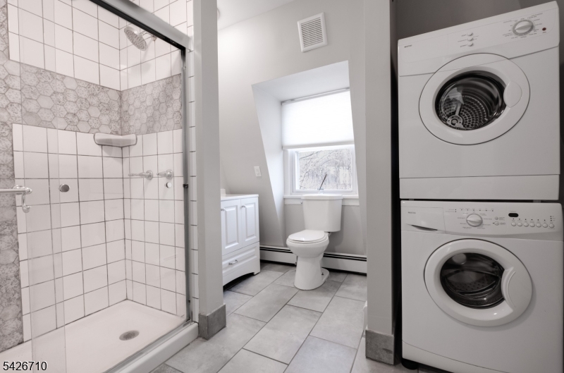 47 Ridgedale Avenue Morristown, NJ 07960 - Photo 9 of 14 a bathroom with a toilet and a shower