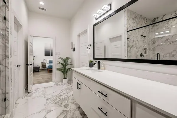 a bathroom with a sink and a mirror