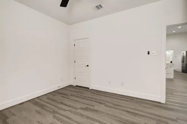 a view of a room with wooden floor