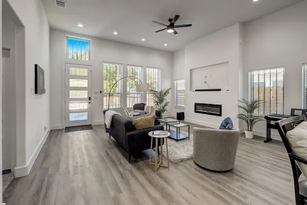 a living room with furniture and a large window