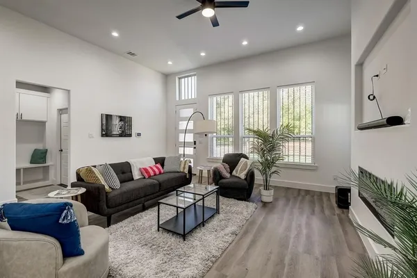 a living room with furniture and a large window