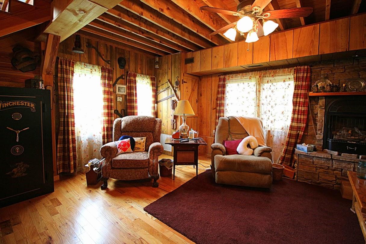 2185 Loops Road Rainelle, WV 25962 - Photo 2 of 109 a living room with furniture a fireplace and a flat screen tv