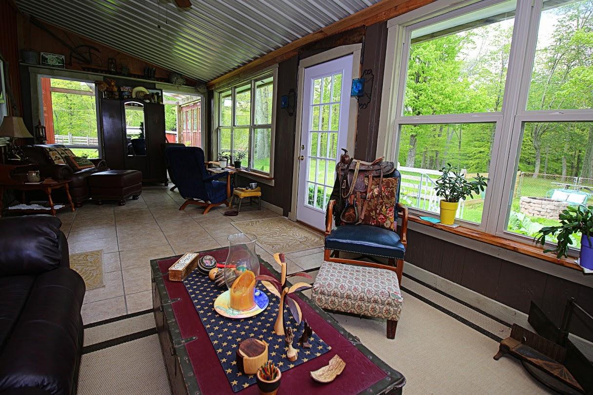 2185 Loops Road Rainelle, WV 25962 - Photo 103 of 109 a living room with furniture and a floor to ceiling window