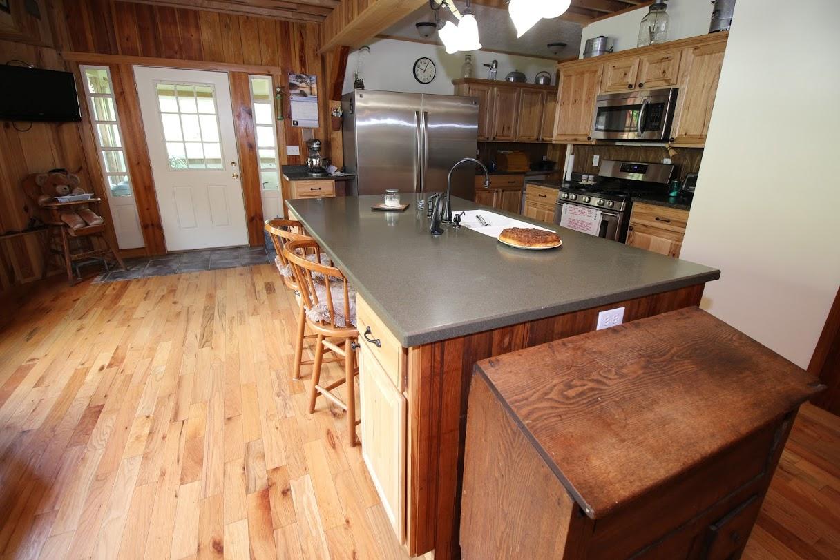 2185 Loops Road Rainelle, WV 25962 - Photo 105 of 109 a kitchen with stainless steel appliances a dining table chairs and granite counter tops